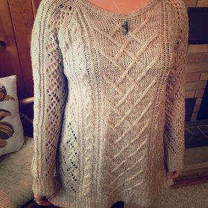 Loose fitting sweater.